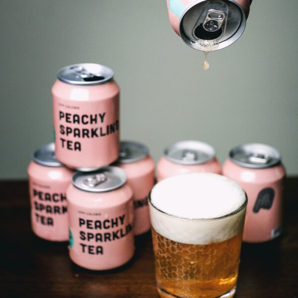 clear glass bottle with brown liquid